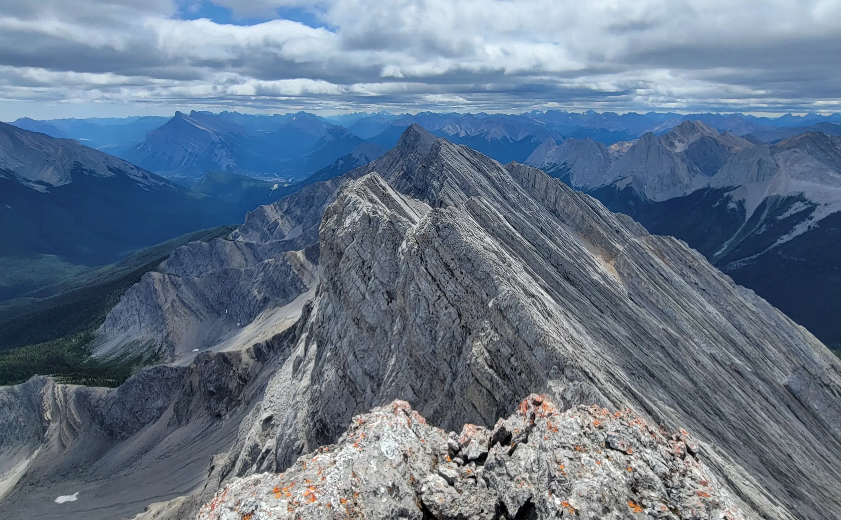 A photo from the summit of the third peak of Mount Brewster looking south towards the other two peaks.